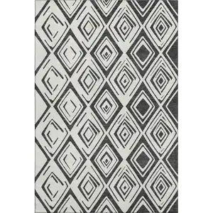 Photo of Ivory And Black Diamond Washable Area Rug With UV Protection