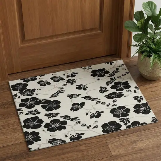 Ivory And Black Floral Washable Area Rug With UV Protection Photo 1