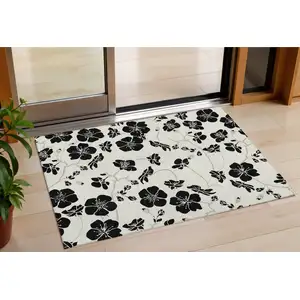 Photo of Ivory And Black Floral Washable Indoor Outdoor Area Rug
