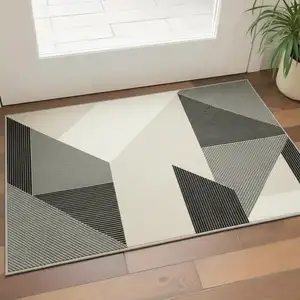 Photo of Ivory And Black Geometric Area Rug