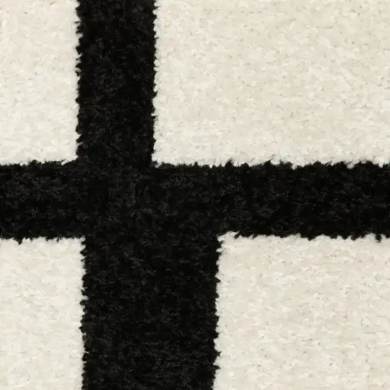 Ivory And Black Geometric Area Rug Photo 9