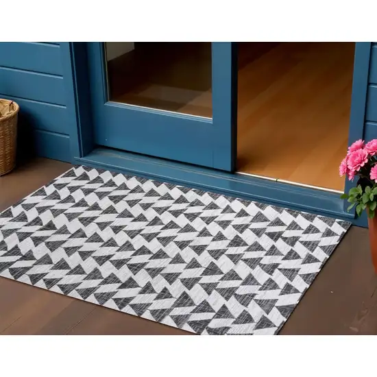 Ivory And Black Geometric Indoor Outdoor Area Rug Photo 1