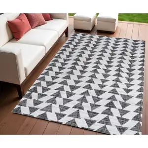 Photo of Ivory And Black Geometric Indoor Outdoor Area Rug