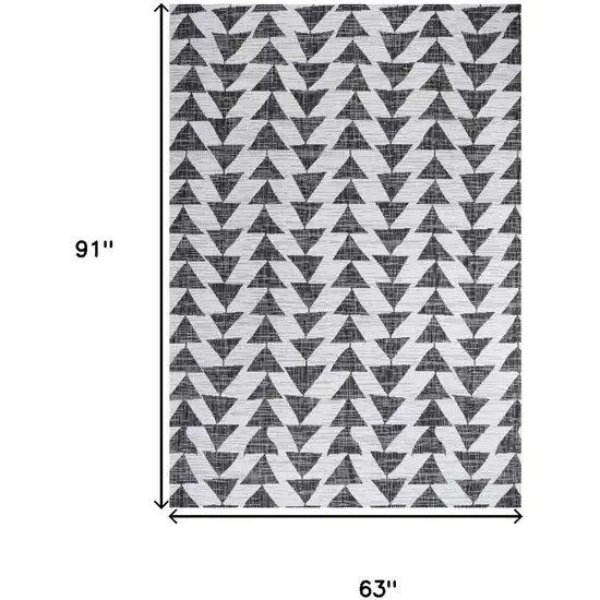 Ivory And Black Geometric Indoor Outdoor Area Rug Photo 3