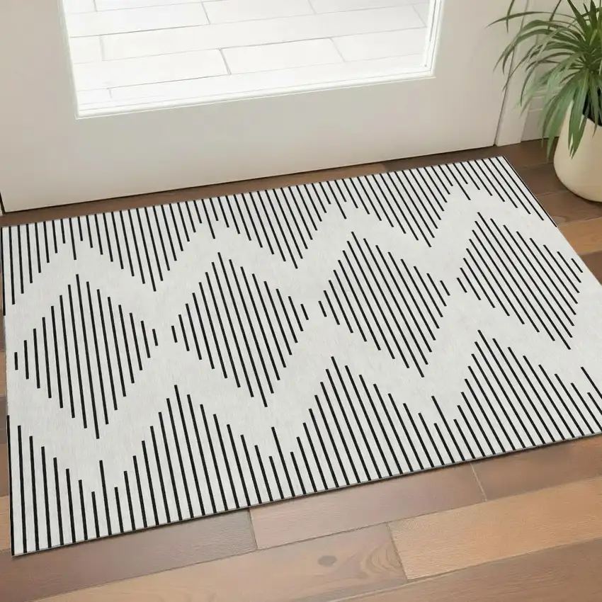 Ivory And Black Geometric Washable Area Rug With UV Protection Photo 1