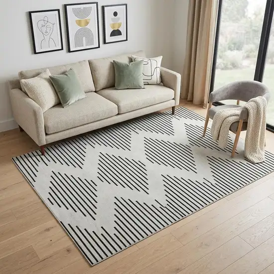 Ivory And Black Geometric Washable Area Rug With UV Protection Photo 1