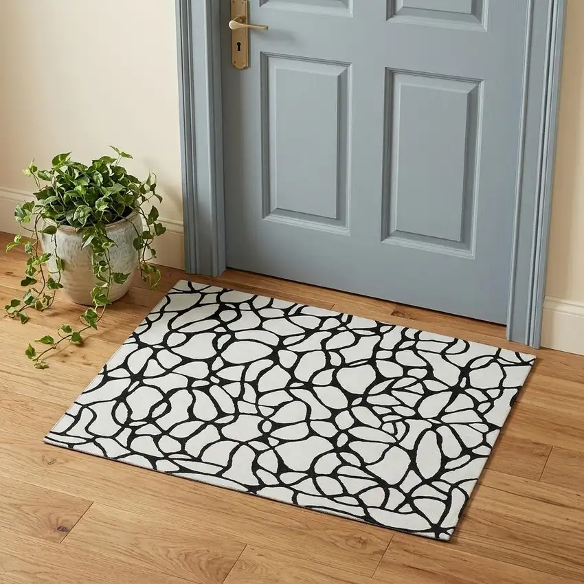 Ivory And Black Geometric Washable Area Rug With UV Protection Photo 1