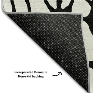 Photo of Ivory And Black Geometric Washable Area Rug With UV Protection