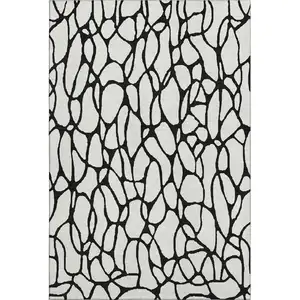 Photo of Ivory And Black Geometric Washable Area Rug With UV Protection