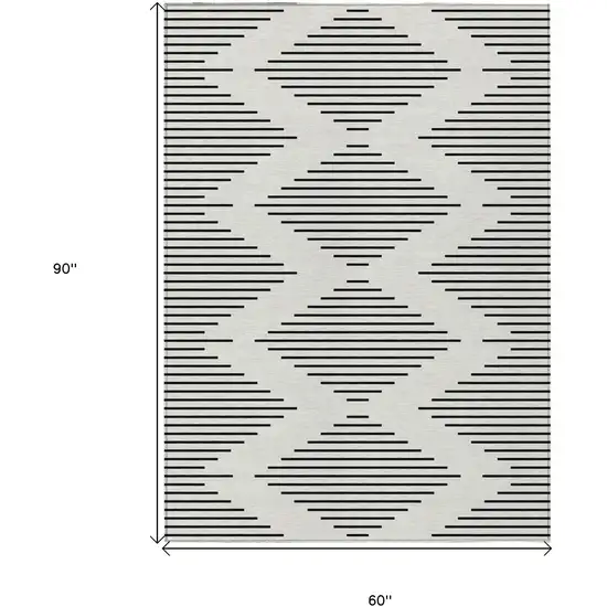 Ivory And Black Geometric Washable Indoor Outdoor Area Rug Photo 3