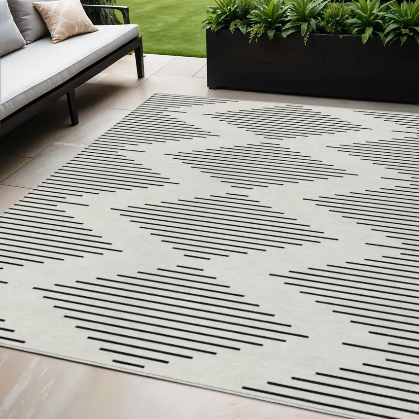 Ivory And Black Geometric Washable Indoor Outdoor Area Rug Photo 1