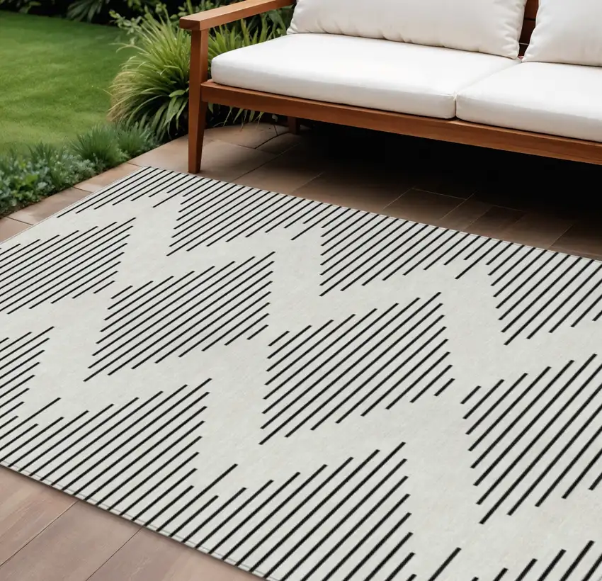 Ivory And Black Geometric Washable Indoor Outdoor Area Rug Photo 1