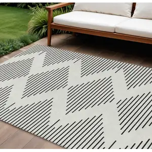 Photo of Ivory And Black Geometric Washable Indoor Outdoor Area Rug