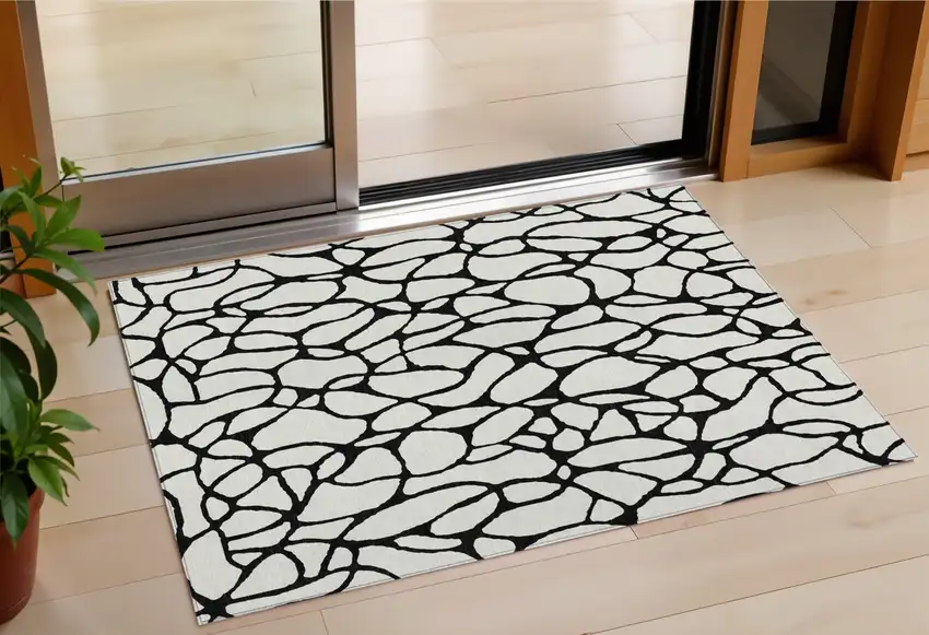 Ivory And Black Geometric Washable Indoor Outdoor Area Rug Photo 1