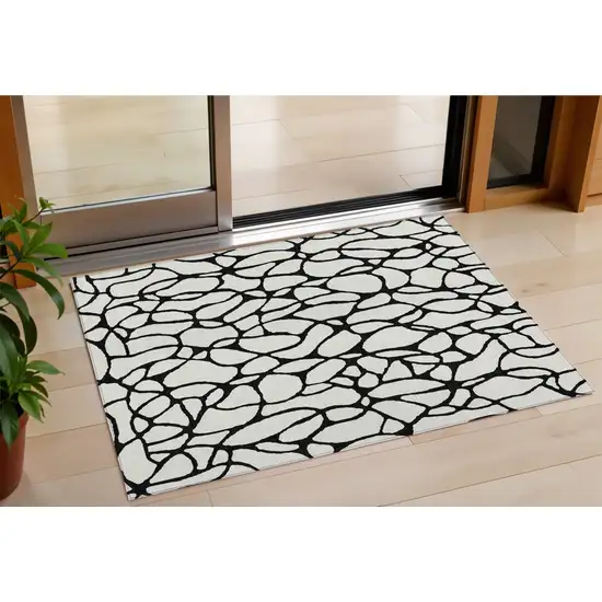 Ivory And Black Geometric Washable Indoor Outdoor Area Rug Photo 1