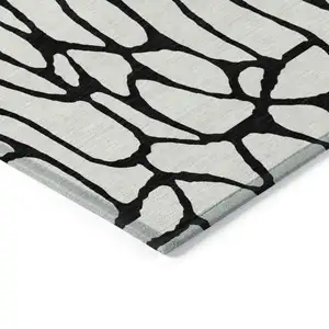 Photo of Ivory And Black Geometric Washable Indoor Outdoor Area Rug