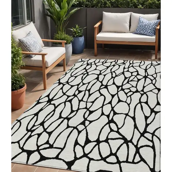 Ivory And Black Geometric Washable Indoor Outdoor Area Rug Photo 1