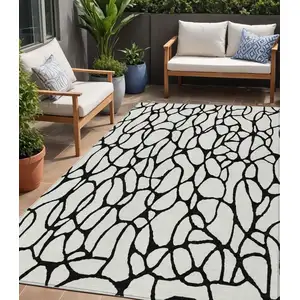 Photo of Ivory And Black Geometric Washable Indoor Outdoor Area Rug