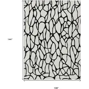 Photo of Ivory And Black Geometric Washable Indoor Outdoor Area Rug