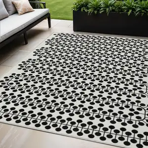 Photo of Ivory And Black Geometric Washable Indoor Outdoor Area Rug