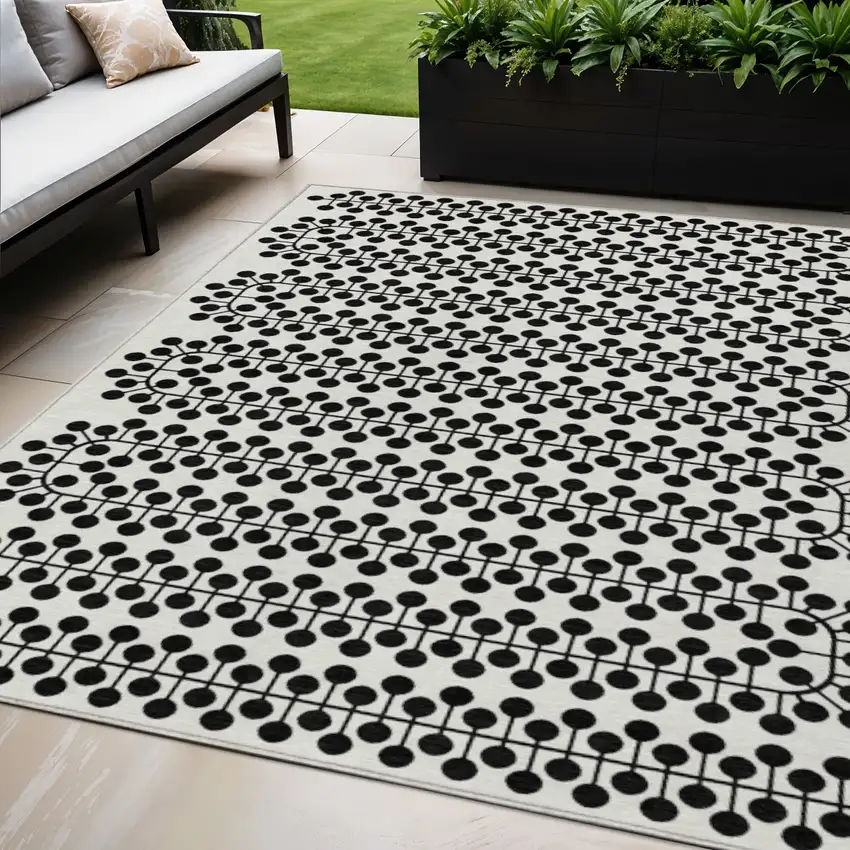 Ivory And Black Geometric Washable Indoor Outdoor Area Rug Photo 1