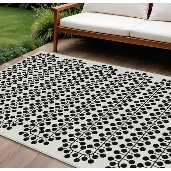 Ivory And Black Geometric Washable Indoor Outdoor Area Rug Photo 1