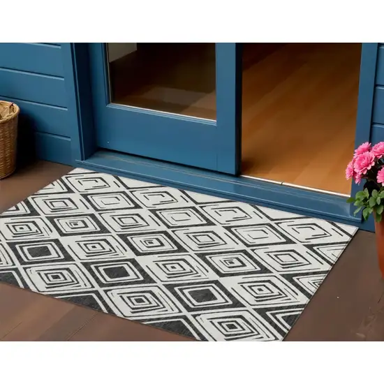 Ivory And Black Geometric Washable Indoor Outdoor Area Rug Photo 1