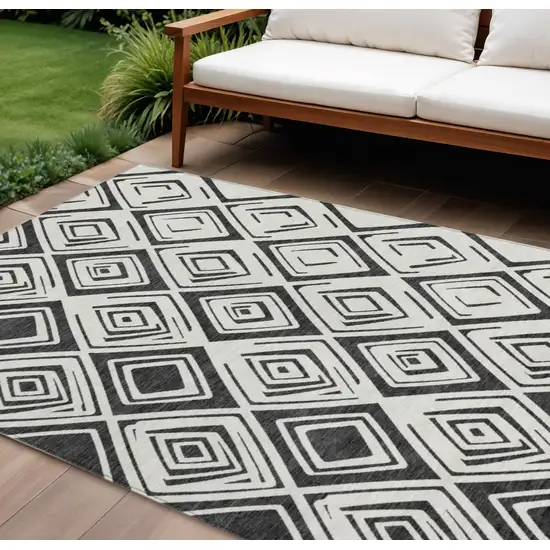 Ivory And Black Geometric Washable Indoor Outdoor Area Rug Photo 1
