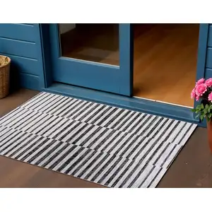 Photo of Ivory And Black Striped Indoor Outdoor Area Rug