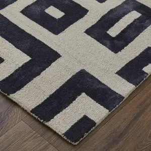 Photo of Ivory And Black Wool Tufted Handmade Area Rug