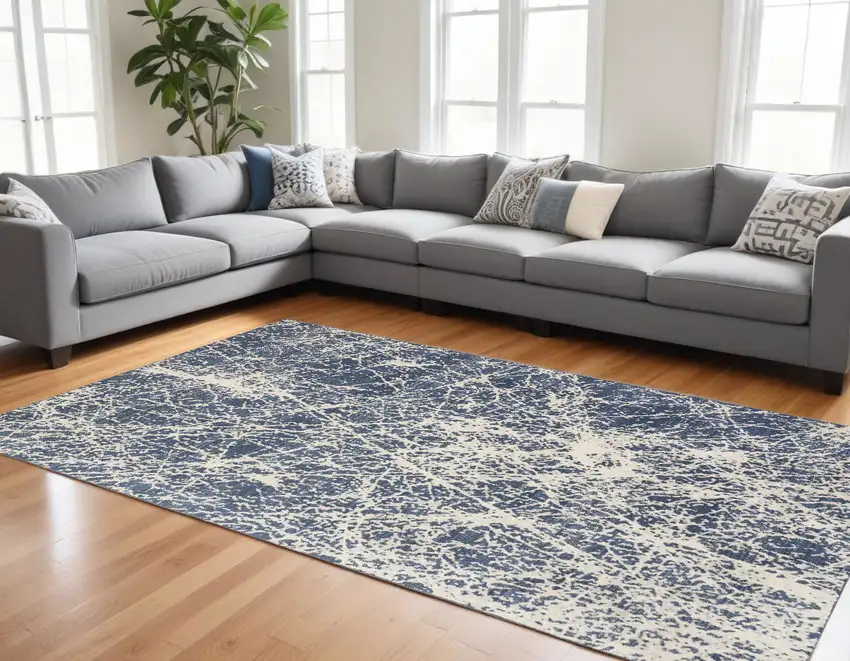 Ivory And Blue Abstract Area Rug Photo 1