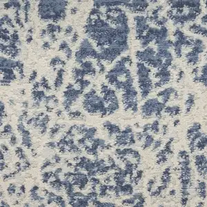 Photo of Ivory And Blue Abstract Area Rug
