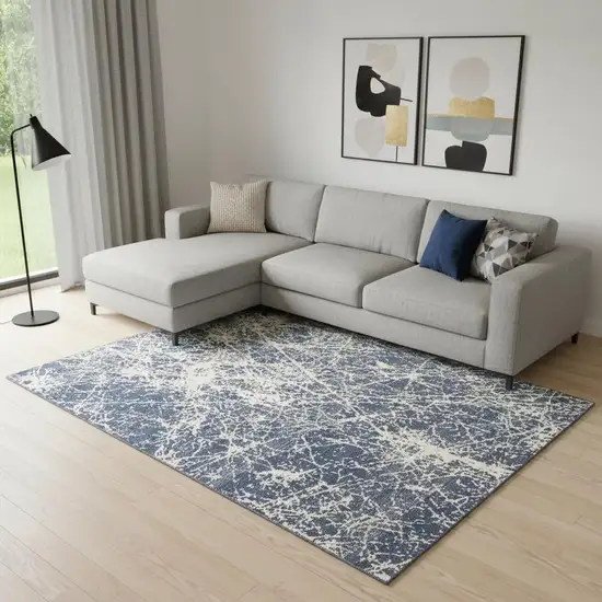 Ivory And Blue Abstract Area Rug Photo 1