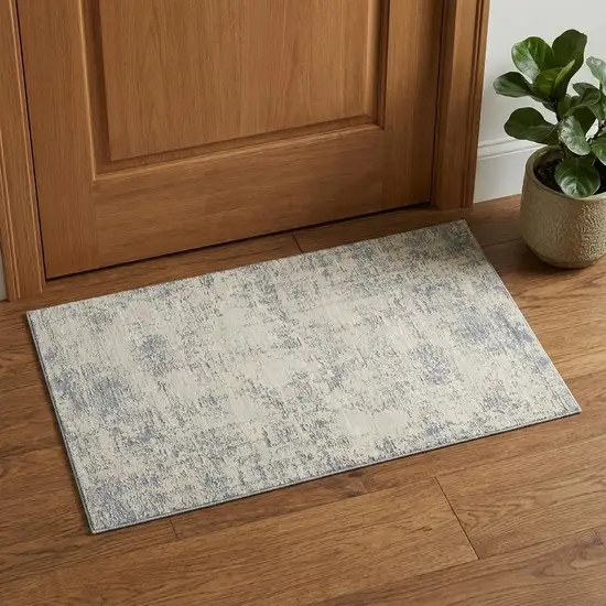 Ivory And Blue Abstract Area Rug Photo 1