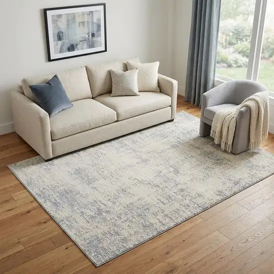 Ivory And Blue Abstract Area Rug Photo 1