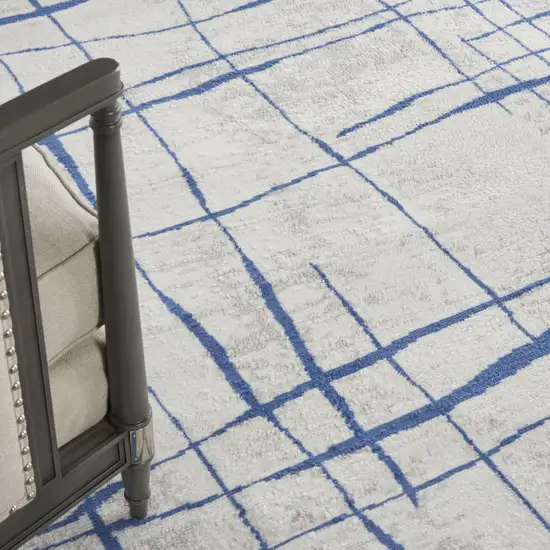 Ivory And Blue Abstract Distressed Area Rug Photo 9
