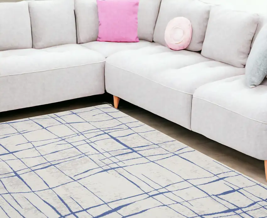 Ivory And Blue Abstract Distressed Area Rug Photo 1