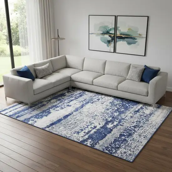 Ivory And Blue Abstract Distressed Area Rug Photo 1