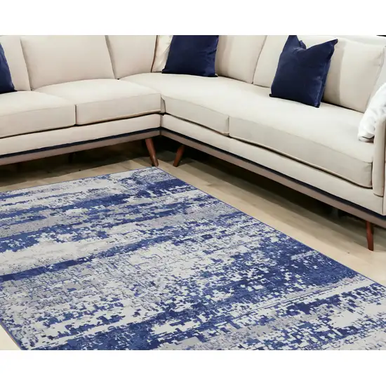 Ivory And Blue Abstract Distressed Area Rug Photo 1