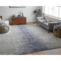 Photo of Ivory And Blue Abstract Power Loom Area Rug