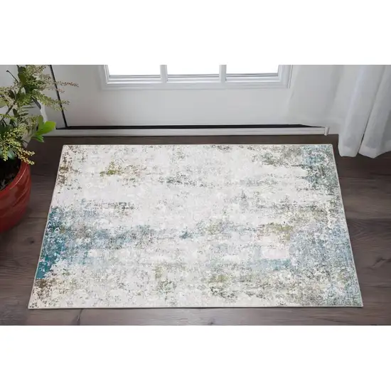 Ivory And Blue Abstract Printed Stain Resistant Non Skid Area Rug Photo 1