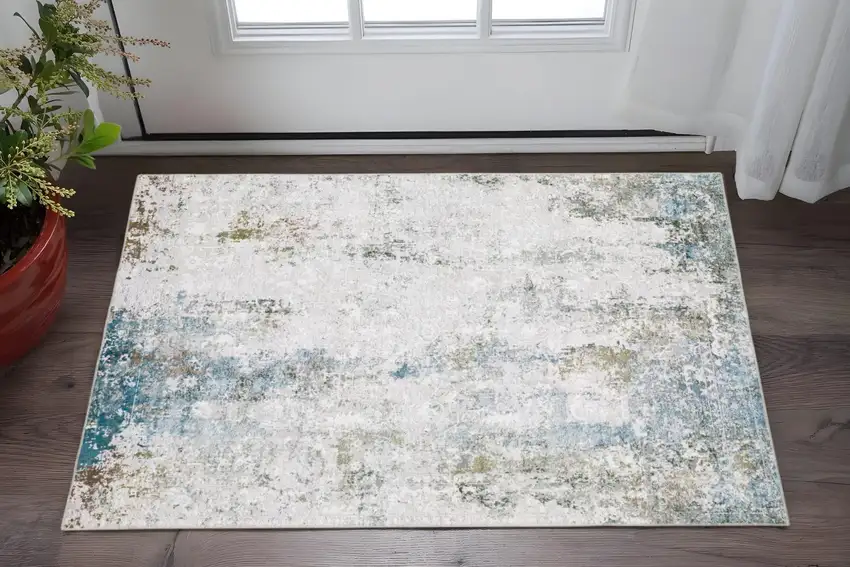 Ivory And Blue Abstract Printed Stain Resistant Non Skid Area Rug Photo 1
