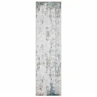 Photo of Ivory And Blue Abstract Printed Stain Resistant Non Skid Runner Rug