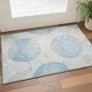 Photo of Ivory And Blue Abstract Washable Area Rug With UV Protection