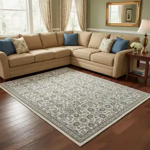 Photo of Ivory And Blue Floral Area Rug With Fringe