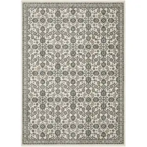 Photo of Ivory And Blue Floral Area Rug With Fringe