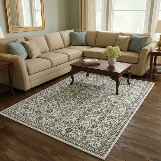 Ivory And Blue Floral Area Rug With Fringe Photo 1