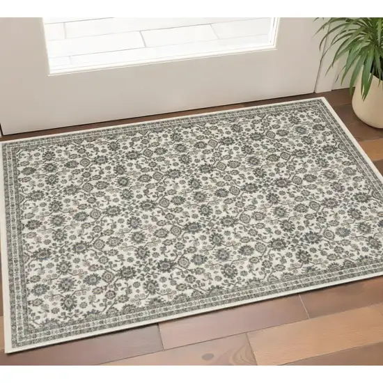 Ivory And Blue Floral Area Rug With Fringe Photo 1