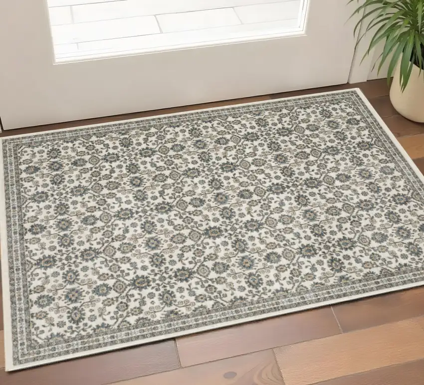 Ivory And Blue Floral Area Rug With Fringe Photo 1