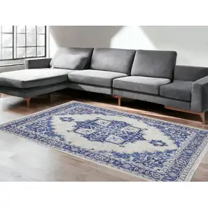Photo of Ivory And Blue Floral Distressed Area Rug